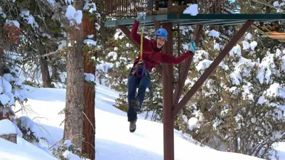 a person jumping in the air in the snow at Hot Tub/Game Tables/Dogs OK - Aspen Glen in Big Bear Lake