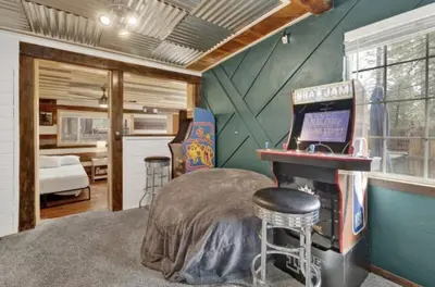 a bedroom with a bed and a desk in a house at Moab Cozy Lane HotTub & Game Room with Pool Table in Big Bear Lake