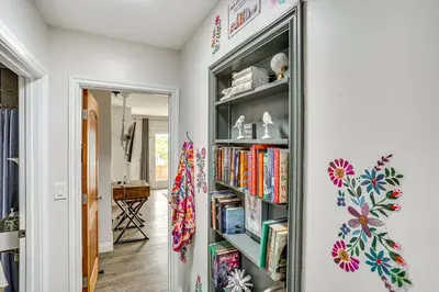 a book shelf filled with books in a room at 2 Mi to Cal State Long Beach Bungalow with Hot Tub! in Long Beach