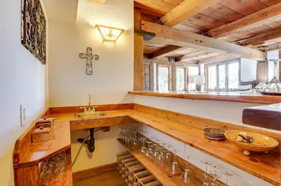 a kitchen with a wooden counter and a sink at Walk to Lake Gregory Family Retreat with Patio! in Crestline