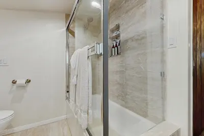 a bathroom with a shower and a toilet at Elevation Escape in Lake Arrowhead