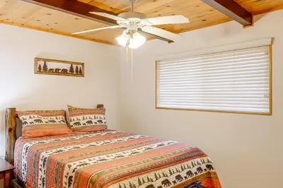 a bedroom with a bed and a ceiling fan at Mountain-View Haven with Deck in Pine Mountain Club in Frazier Park