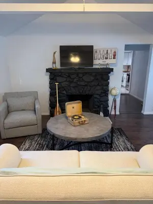a living room with a couch and a fireplace at Serene Lakefront Escape in LA in Lake Hughes