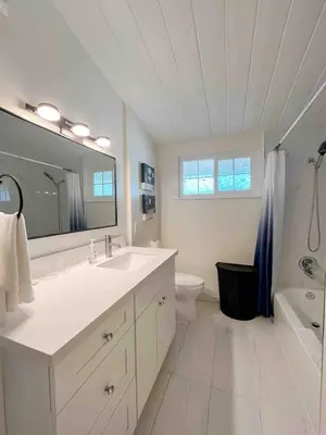 a bathroom with a sink and a toilet and a mirror at New Renovated 3B2B house in West Covina