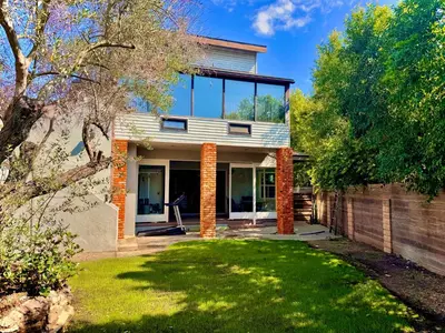 a house with glass windows and a yard at West LA - Family House & Private Yard - 10 mins from LAX & Beach in Los Angeles