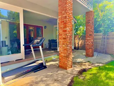 a house with a gym equipment on the front porch at West LA - Family House & Private Yard - 10 mins from LAX & Beach in Los Angeles