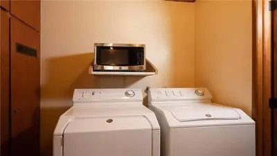 a kitchen with two machines and a microwave on a shelf at Hot Tub, Near Village/Lake - Kelly`s Kottage in Big Bear Lake