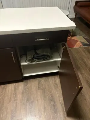 a black cabinet with a white counter top and a drawer at Poolside Palace in Los Angeles