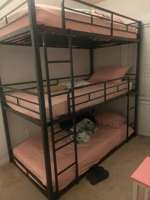 a bunk bed with four bunk beds in a room at Females room bunk beds in Los Angeles