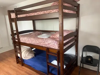 a couple of bunk beds in a room at Females room bunk beds in Los Angeles