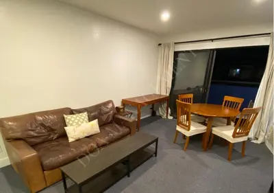 a living room with a couch and a table at Luxury condo in the heart of LA in Los Angeles