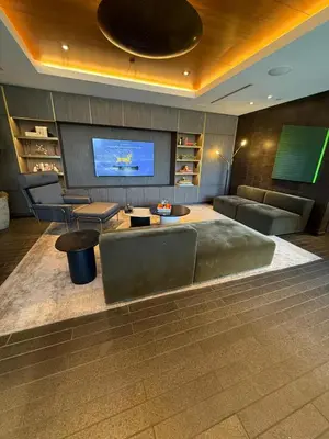 a living room with a couch and a tv at Seven Mile Penthouse Dream Hollywood View Pool in Los Angeles