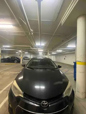 a black car parked in a parking garage at Studio City Chic Large Contemporary Condo in Los Angeles