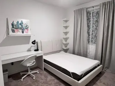 a white bedroom with a desk and a bed and a desk and chair at HelloLA in Whittier