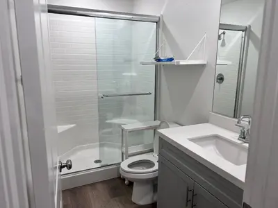 a bathroom with a shower and a toilet and a sink at HelloLA in Whittier