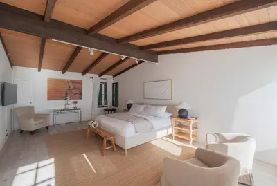 a bedroom with a bed and a table and chairs at Malibu Villa with Beach Access and Ocean View in Malibu