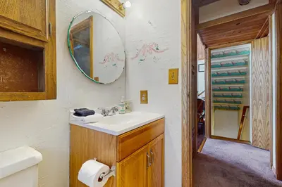 a bathroom with a sink and a mirror at Villa Elvira in Lake Arrowhead