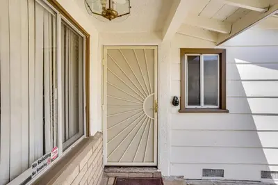 a door on a house with a window at 12 Mi to Dtwn LA Family Home with Patio and Yard! in Downey