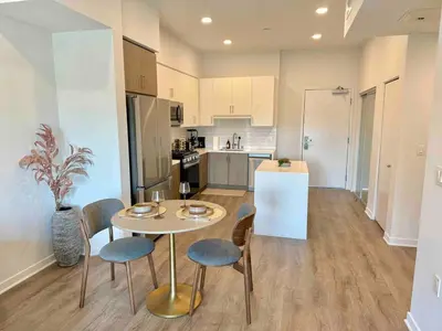a kitchen and a table and chairs in a room at Designer 1 Bedroom Condo in Silver Lake in Los Angeles