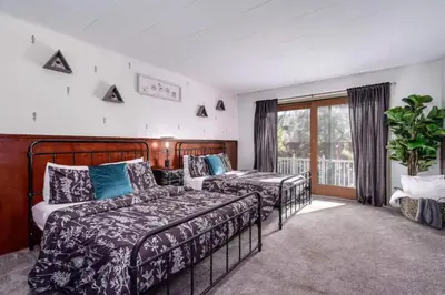 a bedroom with two beds and a window at The Wilderness Haven in Big Bear Lake