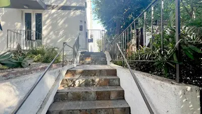 a set of stairs leading up to a house at Charming 1BR in Prime Santa Monica Walk to Beach in Los Angeles