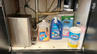 a shelf with detergent and other cleaning products in a sink at Charming 1BR in Prime Santa Monica Walk to Beach in Los Angeles
