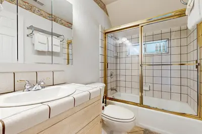 a bathroom with a sink and a toilet and a tub at Bright Moon in Lake Arrowhead