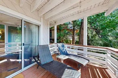 two chairs and a table on a porch at Bright Moon in Lake Arrowhead