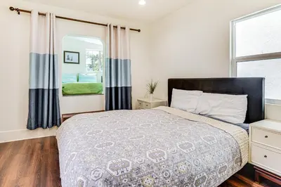 a bedroom with a bed and a window at 1 Mi to Dtwn LA Artists Retreat with Zen Garden in Los Angeles