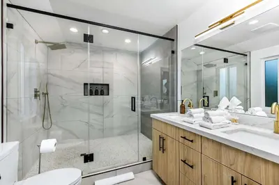 a bathroom with a shower and a toilet and a sink at Villa Incanto in Los Angeles