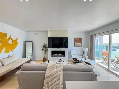 a living room with a couch and a fireplace at Seaside 2BR with Ocean View and Roof Garden - VE3-MDR in Los Angeles