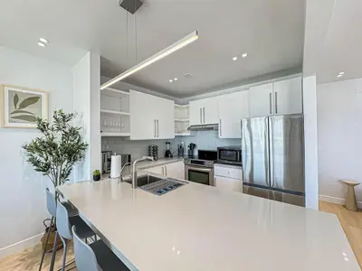 a kitchen with white cabinets and a white counter top at Seaside 2BR with Ocean View and Roof Garden - VE3-MDR in Los Angeles