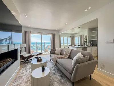 a living room with a couch and a fireplace at Seaside 2BR with Ocean View and Roof Garden - VE3-MDR in Los Angeles