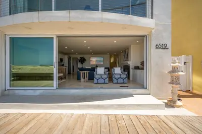a building with a large window with a living room at Ocean Views in Long Beach in Long Beach