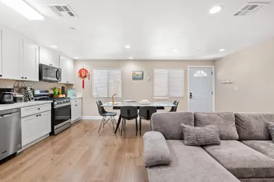 a living room with a couch and a table with chairs at Heartwarming Family Stay 10 Min Walk to Pomona Valley Hospital in Pomona