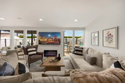 a living room with a couch and a table at Stylish 5 Bedroom Villa with Pool near Disney - Luxury Family Retreat in Anaheim