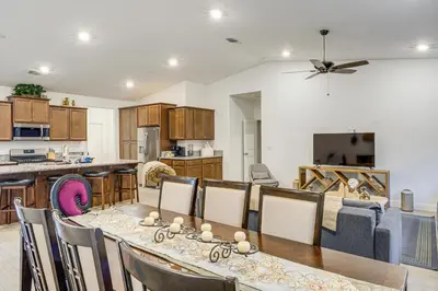 a kitchen and dining room with a table and chairs at 9 Mi to Dtwn Bakersfield Pet-Friendly Home in Bakersfield