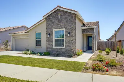 a brick house with a garage at 9 Mi to Dtwn Bakersfield Pet-Friendly Home in Bakersfield