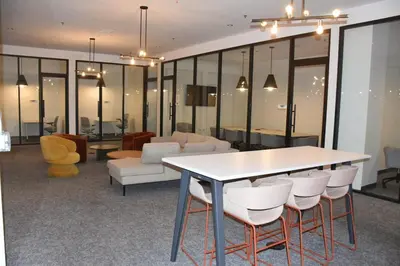 a room with a table and chairs and a couch at Stylist Downtown LA Gateway- Studio Apt in Los Angeles