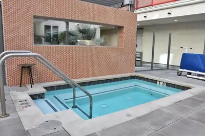 a large swimming pool in a building at Stylish LA studio Prime Location in Los Angeles