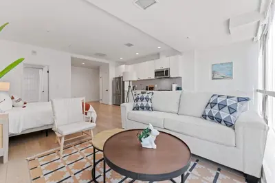 a living room with a couch and a table at Stylish LA studio Prime Location in Los Angeles