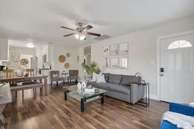 a living room with a couch and a table at Travel Haven - Great Location - Quiet Area in Long Beach