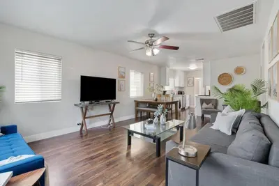 a living room with a couch and a tv at Travel Haven - Great Location - Quiet Area in Long Beach