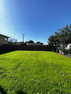 a large yard with a green field of grass at LUXURY VILLA Estate Oasis in Downey