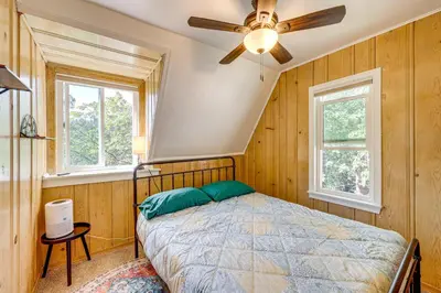 a bedroom with a bed and a ceiling fan at Between Big Bear and Lake Arrowhead - Cabin with View! in Running Springs
