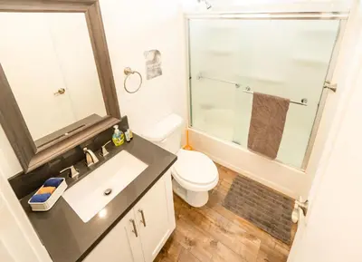 a bathroom with a toilet sink and a shower at Cozy Stylish 1-Bedroom In Hollywood With Free Gated Parking in Los Angeles