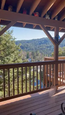 a view from the deck of a cabin at Best View of the Lake! Huge Deck! in Crestline