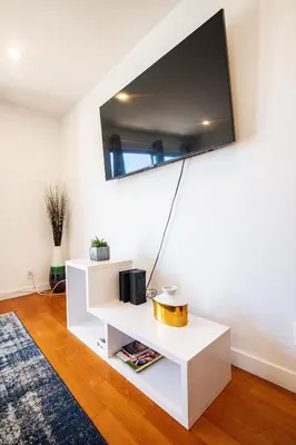 a living room with a tv on the wall at Renovated Culver City Escape Walkable WFH in Los Angeles