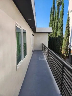 a walkway outside of a house with trees at San Marino guest house in Los Angeles