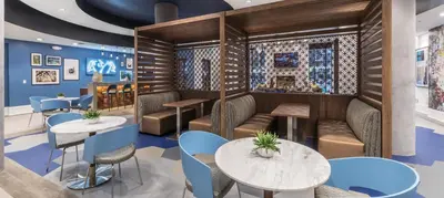 a restaurant with tables and chairs and a wall with tiles at Noho Haven 2 bed Apt with FREE Parking in North Hollywood